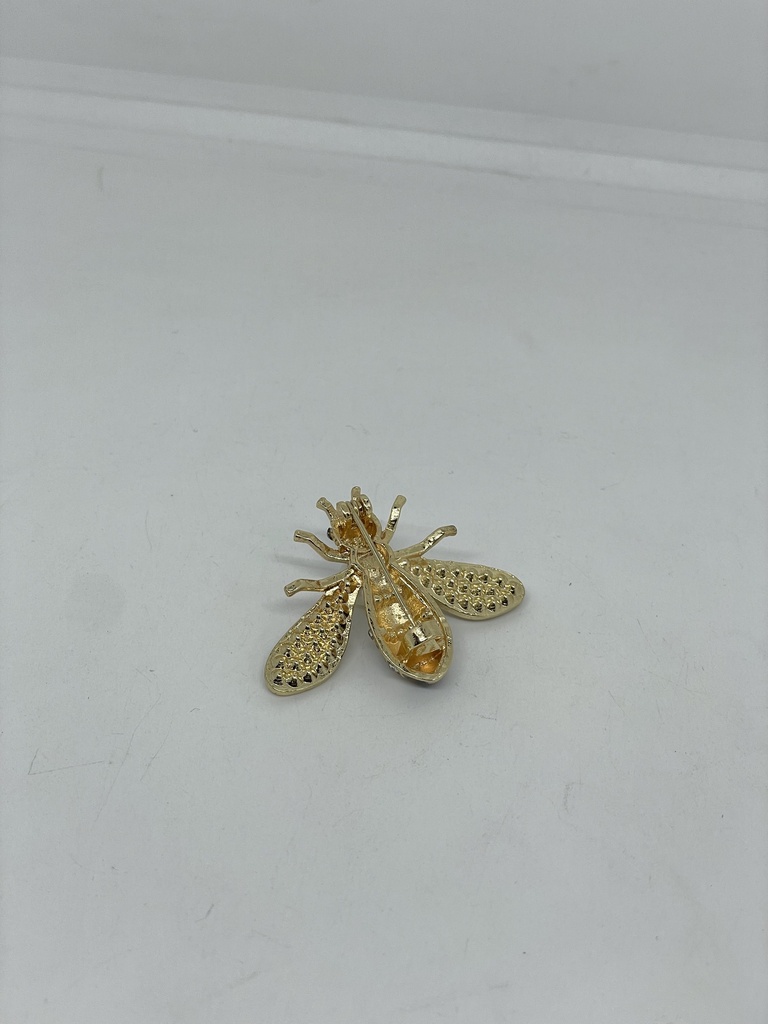 Prendedor dorado con negro de metal de abeja