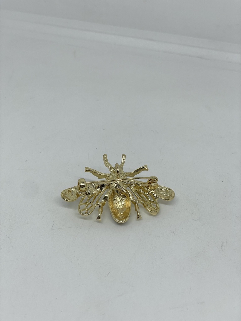 Prendedor dorado con negro de metal de abeja