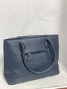 Bolsa azul de cuerina con franjas