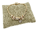 Pulsera dorada de rodio con dijes