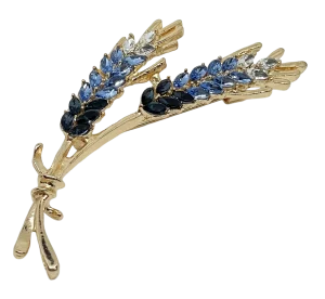Prendedor dorado con azul y brillantitos