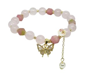 Pulsera rosada de perla con dije de mariposa